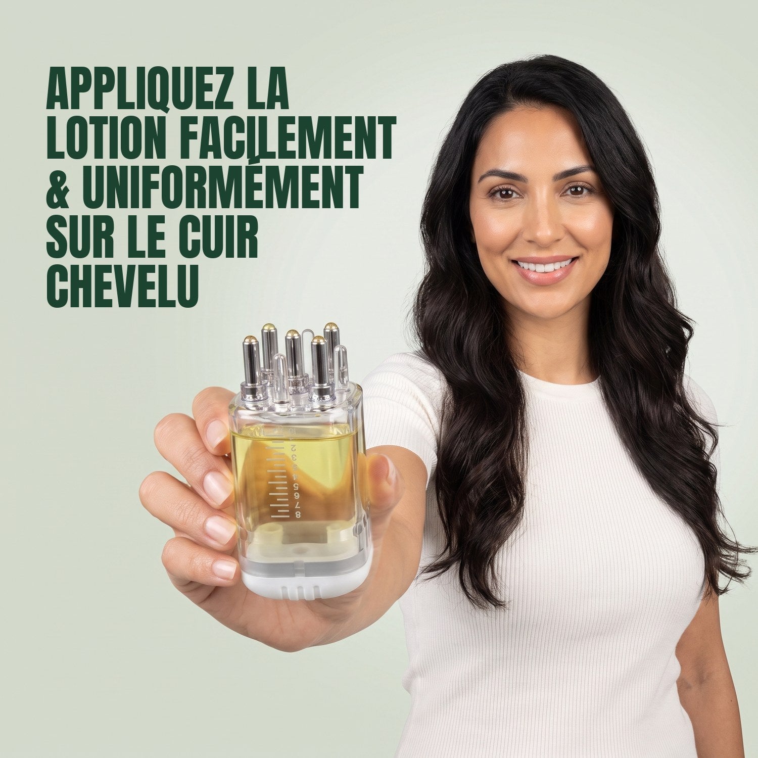 Woman holding a premium minoxidil lotion applicator against a green background